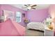 Pink bedroom features a ceiling fan, window, bed and a play teepee tent at 1491 Kolb Ridge Sw Dr, Marietta, GA 30008