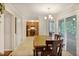 Dining area with view of the kitchen and screened porch at 1491 Kolb Ridge Sw Dr, Marietta, GA 30008