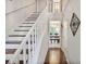 Bright entryway showcasing wood stairs, hardwood floors and decorative accents at 1491 Kolb Ridge Sw Dr, Marietta, GA 30008