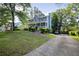 Stylish two-story house with a welcoming front porch and a long private driveway at 1491 Kolb Ridge Sw Dr, Marietta, GA 30008