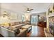 Cozy living room featuring a stone fireplace, plush seating, and hardwood floors at 1491 Kolb Ridge Sw Dr, Marietta, GA 30008