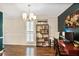 Bright office space featuring a bookshelf, modern decor, and hardwood floors at 1491 Kolb Ridge Sw Dr, Marietta, GA 30008