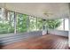 Relaxing screened porch offers views of the surrounding greenery, promoting privacy at 1491 Kolb Ridge Sw Dr, Marietta, GA 30008