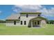 Spacious backyard featuring a covered patio perfect for outdoor entertaining and relaxing at 211 Linford Dr, Locust Grove, GA 30248