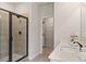 A pristine bathroom features a glass shower and modern sink at 211 Linford Dr, Locust Grove, GA 30248
