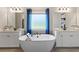 The bathroom displays a large tub and double sink at 211 Linford Dr, Locust Grove, GA 30248