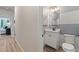 A cozy bathroom offers a sleek vanity and modern fixtures at 211 Linford Dr, Locust Grove, GA 30248