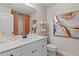 Well-lit bathroom with a white vanity, modern fixtures, and stylish decor at 211 Linford Dr, Locust Grove, GA 30248