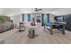 Spacious game room with a pool table, a large sofa, and a modern entertainment center at 211 Linford Dr, Locust Grove, GA 30248