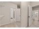 A practical walk-in closet connects to hallway and bedrooms at 211 Linford Dr, Locust Grove, GA 30248