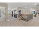 Bright hallway featuring decorative railings, an open floorplan, and access to other rooms at 211 Linford Dr, Locust Grove, GA 30248