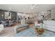 Expansive open-concept living area with a modern kitchen, dining area, comfortable seating, and abundant natural light at 211 Linford Dr, Locust Grove, GA 30248