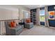 Cozy sitting area with comfortable chairs, a small table, and natural light from the nearby windows at 211 Linford Dr, Locust Grove, GA 30248