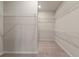 A spacious walk-in closet offering ample storage space at 211 Linford Dr, Locust Grove, GA 30248