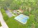 Community aerial view of the pool, clubhouse, playground, tennis courts, and parking at 2333 Orion Ct, Grayson, GA 30017