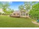 Expansive backyard with a deck and lush greenery at 2333 Orion Ct, Grayson, GA 30017