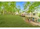 Spacious backyard with lush lawn, fire pit area, and large deck perfect for outdoor entertaining at 2333 Orion Ct, Grayson, GA 30017
