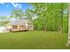 Large backyard with lush lawn and wood deck, offering an ideal space for relaxation and recreation at 2333 Orion Ct, Grayson, GA 30017