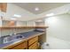 Entertainer's basement bar area with sink and wood countertop for a welcoming atmosphere at 2333 Orion Ct, Grayson, GA 30017