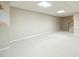 Large finished basement with neutral carpet, white trim and a stairway at 2333 Orion Ct, Grayson, GA 30017
