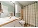 Traditional bathroom featuring vanity, toilet and shower/tub combo with printed curtain at 2333 Orion Ct, Grayson, GA 30017