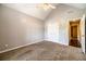 A bedroom with plush carpet, a closet, and a doorway to another room at 2333 Orion Ct, Grayson, GA 30017