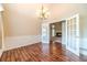 Dining room featuring wood floors, wainscoting, and a modern chandelier at 2333 Orion Ct, Grayson, GA 30017