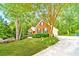 Charming brick home with well-manicured front yard and mature trees at 2333 Orion Ct, Grayson, GA 30017