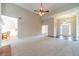 Spacious living room featuring high ceilings, plush carpeting, and natural light at 2333 Orion Ct, Grayson, GA 30017