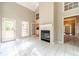 Open living area featuring tile flooring, a fireplace, and access to the backyard at 2333 Orion Ct, Grayson, GA 30017