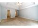 Primary bedroom features a vaulted ceiling, soft blue walls, and plush carpet at 2333 Orion Ct, Grayson, GA 30017
