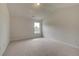 Neutral bedroom with vaulted ceilings, carpeted flooring, and natural light at 234 Linford Dr, Locust Grove, GA 30248
