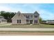 Charming two-story home with brick and siding exterior and well-maintained front yard at 234 Linford Dr, Locust Grove, GA 30248