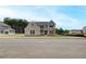 Beautiful new construction home featuring a mix of brick and siding and a manicured lawn at 234 Linford Dr, Locust Grove, GA 30248
