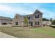 An attractive new home featuring mixed brick and siding and a neatly landscaped lawn at 234 Linford Dr, Locust Grove, GA 30248