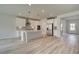 Bright, open kitchen featuring stainless steel appliances, white cabinets, and a large central island at 234 Linford Dr, Locust Grove, GA 30248