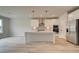 Modern kitchen featuring white cabinets, stainless appliances, and a functional center island at 234 Linford Dr, Locust Grove, GA 30248