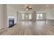 Spacious living room with hardwood floors, a fireplace, and access to the outdoor area at 234 Linford Dr, Locust Grove, GA 30248