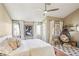 Bright bedroom with a ceiling fan, windows, natural light, and inviting decor at 3268 Clairmont Ne, Brookhaven, GA 30329