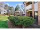 Townhouse exterior with mature landscaping, brick facade, and well-maintained grounds at 3268 Clairmont Ne, Brookhaven, GA 30329