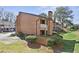 Beautiful brick townhome with a private balcony and well-kept landscaping at 3268 Clairmont Ne, Brookhaven, GA 30329