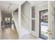 Foyer and stairway with natural light, with views through the front door at 3268 Clairmont Ne, Brookhaven, GA 30329
