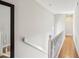 Bright hallway with hardwood floors and white trim, leading to other rooms at 3268 Clairmont Ne, Brookhaven, GA 30329