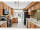 Well-lit kitchen with stainless steel appliances and generous counter space at 3268 Clairmont Ne, Brookhaven, GA 30329