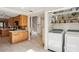 Kitchen with wooden cabinets, adjoining an entrance hall and laundry, creating functionality at 3268 Clairmont Ne, Brookhaven, GA 30329