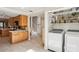 Convenient laundry room with storage shelves, located off of the kitchen area at 3268 Clairmont Ne, Brookhaven, GA 30329