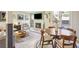 Comfortable living space with a fireplace, wood furniture, and an adjacent dining area with natural light at 3268 Clairmont Ne, Brookhaven, GA 30329
