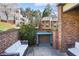 Secluded patio area with privacy walls, lush greenery, and outdoor furniture at 3268 Clairmont Ne, Brookhaven, GA 30329