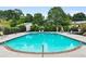 Relaxing community swimming pool surrounded by lounge chairs and lush landscaping at 3268 Clairmont Ne, Brookhaven, GA 30329