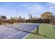 Well-maintained community tennis court with blue and green surface, surrounded by trees at 3268 Clairmont Ne, Brookhaven, GA 30329